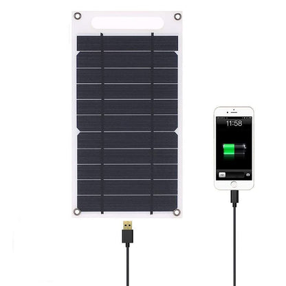 Portable solar panel charging a phone